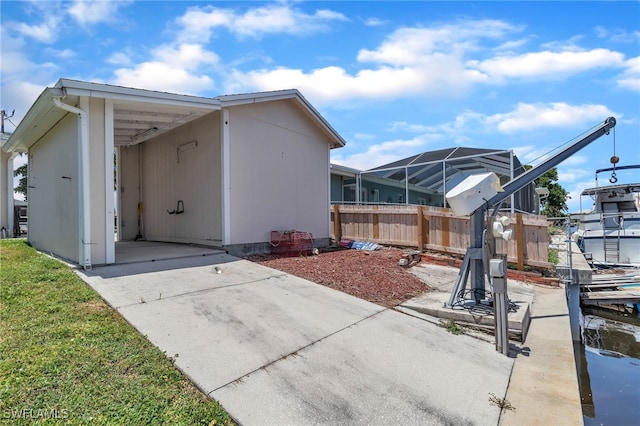 4330 S Canal Cir, North Fort Myers, FL 33903 - view of property exterior with fence and concrete driveway