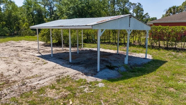 3815 Kittyhawk Dr, Fort Myers, FL 33905 - view of property's community with a carport and a lawn