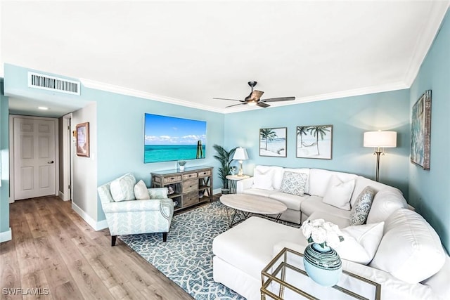 333 Harbour Dr Unit 201, Naples, FL 34103 - living area featuring baseboards, a ceiling fan, wood finished floors, and crown molding