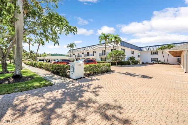 333 Harbour Dr Unit 201, Naples, FL 34103 - view of front facade featuring stucco siding