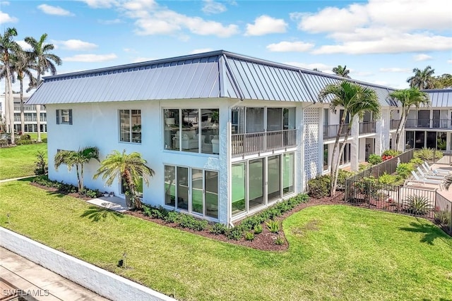 333 Harbour Dr Unit 201, Naples, FL 34103 - view of property exterior featuring stucco siding