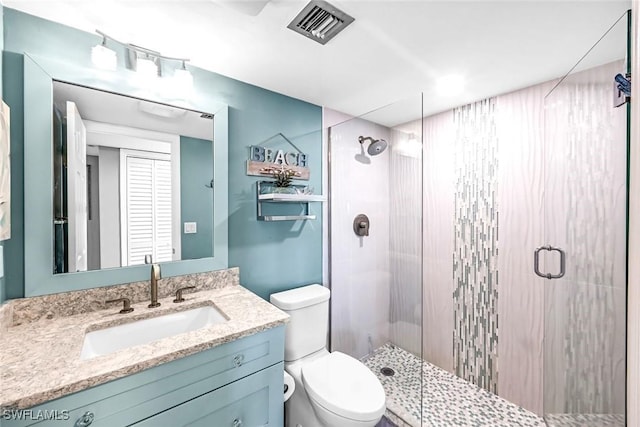333 Harbour Dr Unit 201, Naples, FL 34103 - bathroom featuring toilet, a shower stall, and vanity
