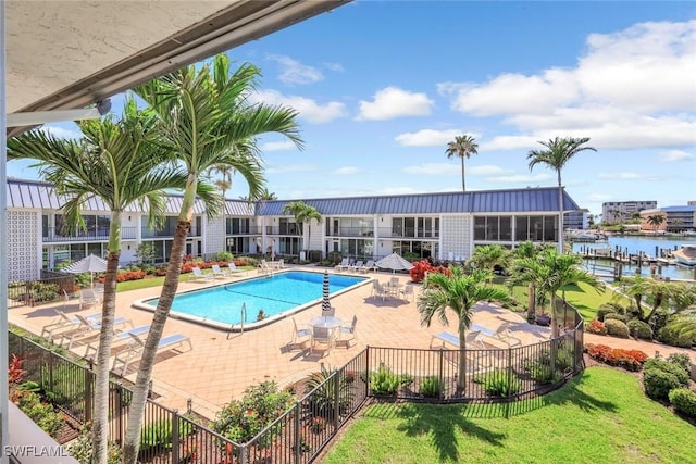 333 Harbour Dr Unit 201, Naples, FL 34103 - community pool featuring a patio and a water view