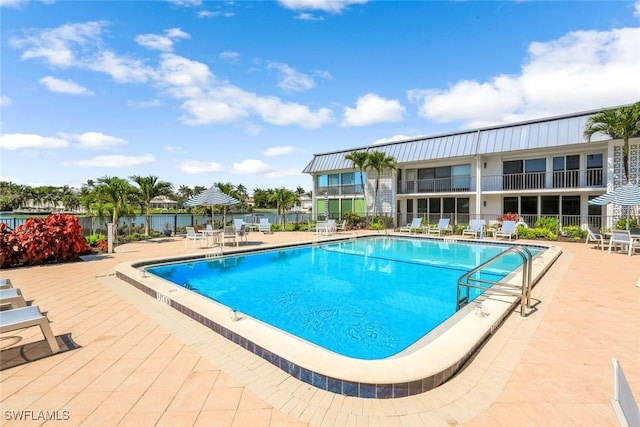 333 Harbour Dr Unit 201, Naples, FL 34103 - community pool featuring a patio