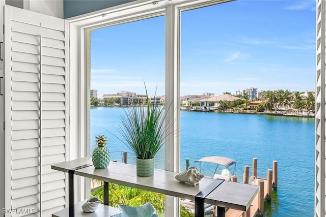333 Harbour Dr Unit 201, Naples, FL 34103 - interior space with a water view and plenty of natural light