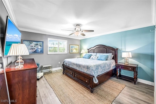 333 Harbour Dr Unit 201, Naples, FL 34103 - bedroom featuring crown molding, light wood-type flooring, baseboards, and a ceiling fan