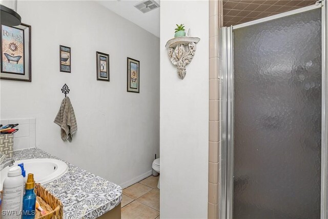 13031 9th St, Fort Myers, FL 33905 - full bath featuring a shower stall, tile patterned flooring, toilet, and vanity