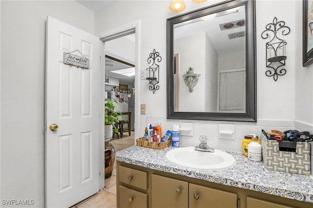 13031 9th St, Fort Myers, FL 33905 - bathroom featuring vanity, tile patterned flooring, and backsplash
