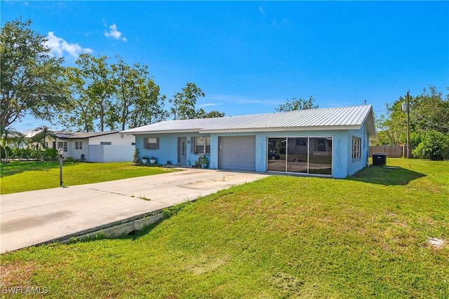 13031 9th St, Fort Myers, FL 33905 - ranch-style home featuring stucco siding, a garage, concrete driveway, and metal roof