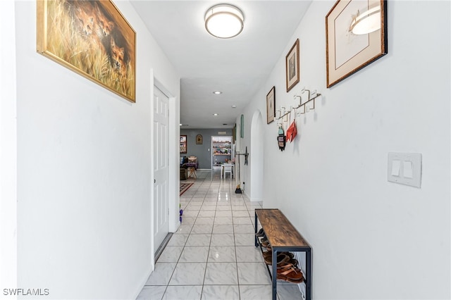 626 103rd Ave N, Naples, FL 34108 - corridor featuring light marble finish floors, recessed lighting, and arched walkways