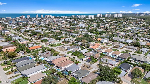 626 103rd Ave N, Naples, FL 34108 - aerial overview of property's location featuring nearby urban area and a nearby body of water