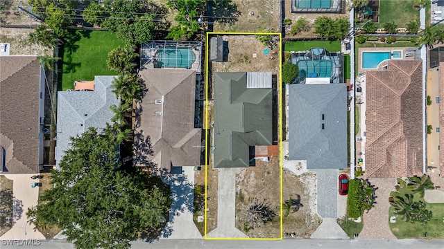 626 103rd Ave N, Naples, FL 34108 - aerial perspective of suburban area with property boundaries highlighted and a pool area