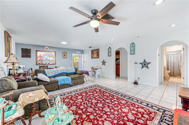 626 103rd Ave N, Naples, FL 34108 - living room with arched walkways, ceiling fan, light tile patterned floors, recessed lighting, and baseboards