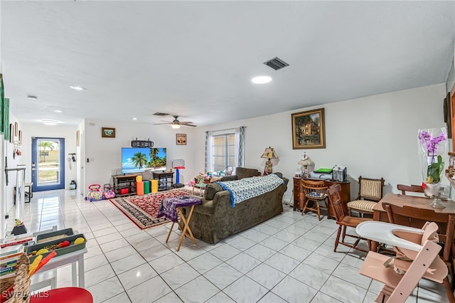 626 103rd Ave N, Naples, FL 34108 - living area featuring healthy amount of natural light, light tile patterned floors, ceiling fan, and recessed lighting