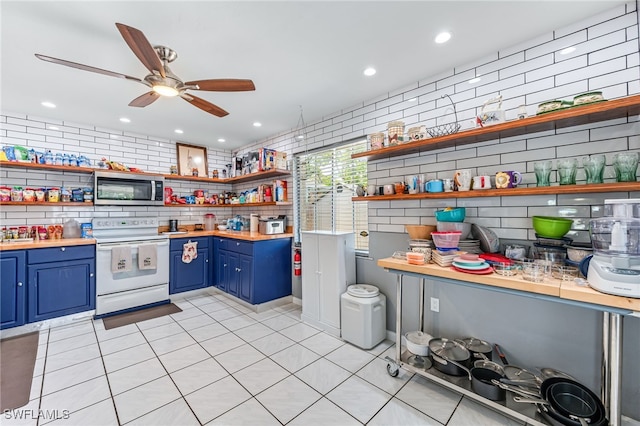 626 103rd Ave N, Naples, FL 34108 - kitchen featuring blue cabinetry, white electric stove, stainless steel microwave, open shelves, and ceiling fan