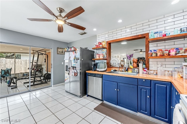 626 103rd Ave N, Naples, FL 34108 - kitchen featuring open shelves, stainless steel appliances, ceiling fan, blue cabinets, and wood counters