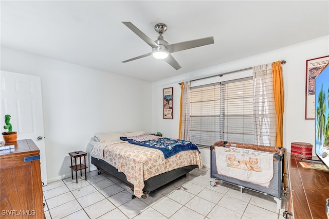 626 103rd Ave N, Naples, FL 34108 - bedroom featuring light tile patterned flooring and ceiling fan