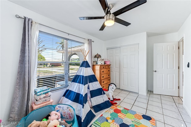 626 103rd Ave N, Naples, FL 34108 - rec room featuring light tile patterned floors, a ceiling fan, and baseboards