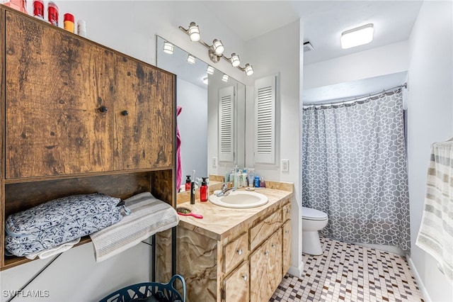 626 103rd Ave N, Naples, FL 34108 - bathroom featuring vanity, toilet, tile patterned floors, and a shower with curtain