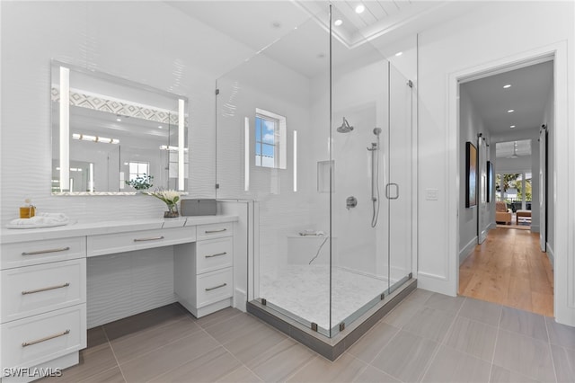 217 13th St S, Naples, FL 34102 - full bathroom featuring a shower stall, vanity, tile patterned floors, and recessed lighting