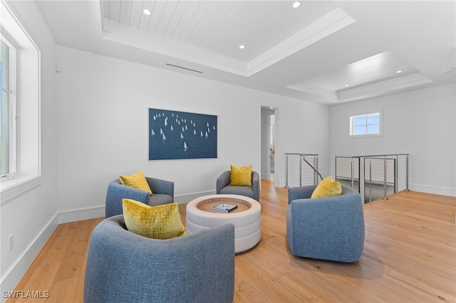 217 13th St S, Naples, FL 34102 - living area with a tray ceiling, an upstairs landing, wood finished floors, recessed lighting, and baseboards