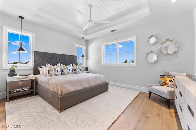 217 13th St S, Naples, FL 34102 - bedroom featuring a tray ceiling, wood-type flooring, wood ceiling, baseboards, and a ceiling fan