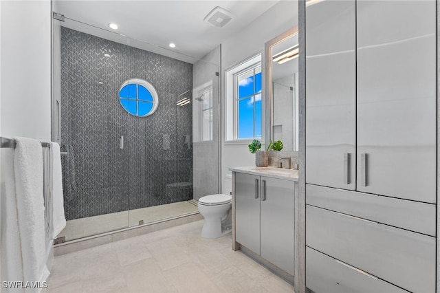 217 13th St S, Naples, FL 34102 - full bath featuring toilet, vanity, a shower stall, and recessed lighting