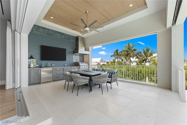 217 13th St S, Naples, FL 34102 - view of patio / terrace with an outdoor kitchen, grilling area, ceiling fan, and outdoor dining area