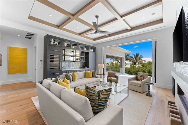 217 13th St S, Naples, FL 34102 - living room featuring coffered ceiling, light wood-style flooring, baseboards, a ceiling fan, and beam ceiling