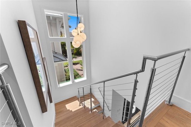 217 13th St S, Naples, FL 34102 - stairs featuring wood finished floors and baseboards