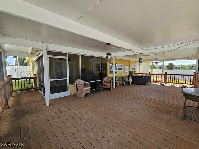 3903 1st St SW, Lehigh Acres, FL 33976 - wooden deck featuring a sunroom
