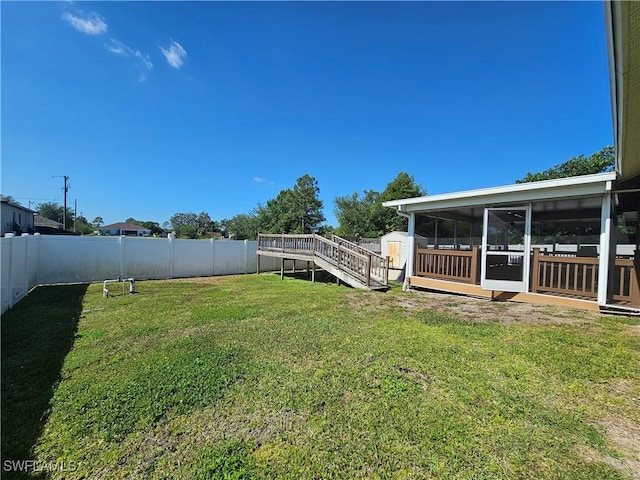 3903 1st St SW, Lehigh Acres, FL 33976 - view of yard with a sunroom and a deck