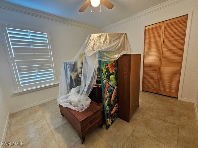 3903 1st St SW, Lehigh Acres, FL 33976 - bedroom / living area view of ornamental molding, a ceiling fan, and baseboards