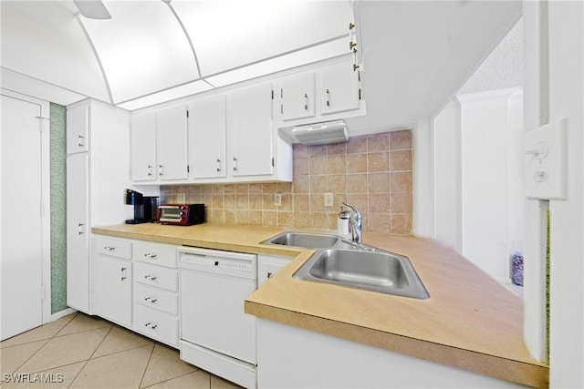 1977 Gulf Shore Blvd N Unit 302, Naples, FL 34102 - kitchen with white dishwasher, a sink, light countertops, and white cabinetry