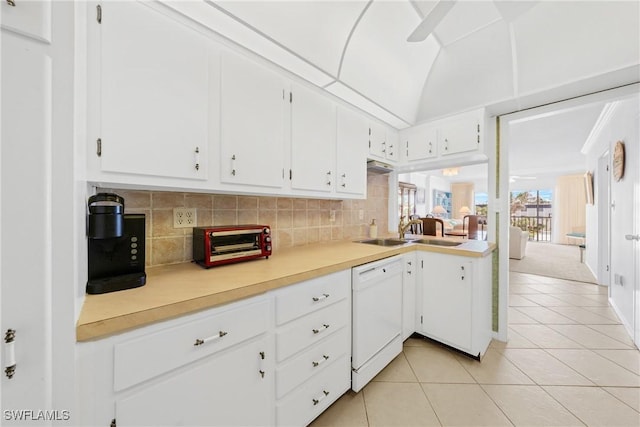 1977 Gulf Shore Blvd N Unit 302, Naples, FL 34102 - kitchen featuring dishwasher, a sink, light tile patterned floors, light countertops, and decorative backsplash