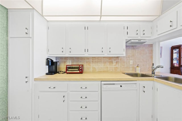 1977 Gulf Shore Blvd N Unit 302, Naples, FL 34102 - kitchen featuring white dishwasher, tasteful backsplash, light countertops, and white cabinetry