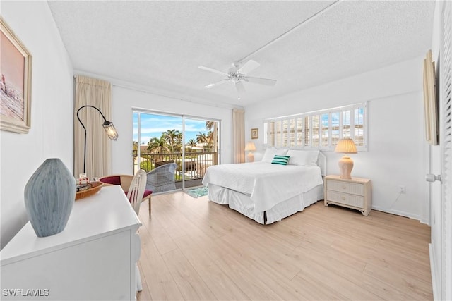 1977 Gulf Shore Blvd N Unit 302, Naples, FL 34102 - bedroom featuring access to exterior, a textured ceiling, light wood finished floors, and ceiling fan
