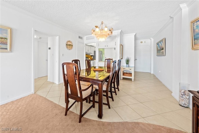 1977 Gulf Shore Blvd N Unit 302, Naples, FL 34102 - dining area with a chandelier, light tile patterned floors, ornamental molding, a textured ceiling, and baseboards