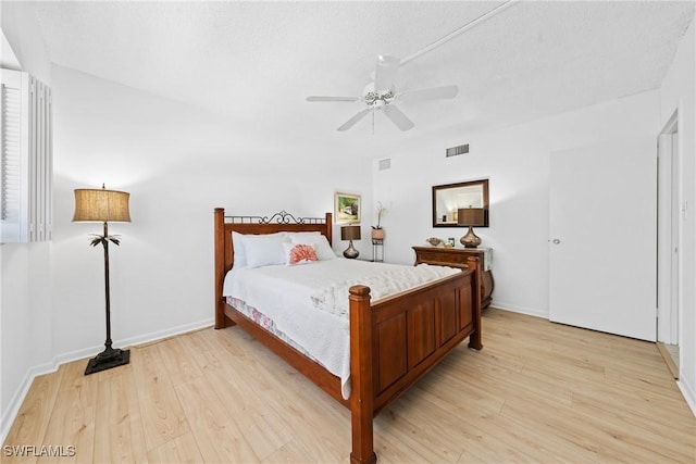 1977 Gulf Shore Blvd N Unit 302, Naples, FL 34102 - bedroom with light wood-type flooring, ceiling fan, and baseboards