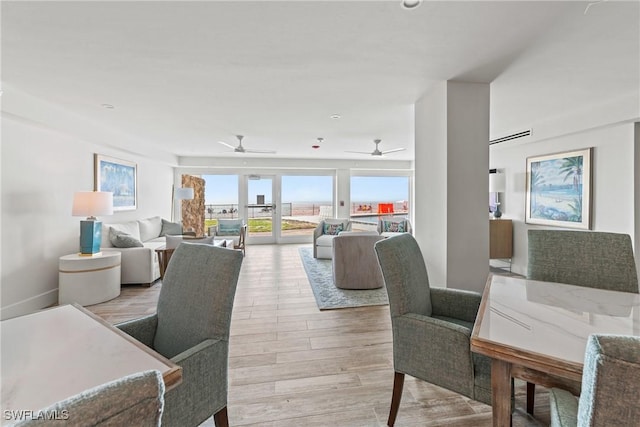 1977 Gulf Shore Blvd N Unit 302, Naples, FL 34102 - dining room with light wood finished floors and ceiling fan
