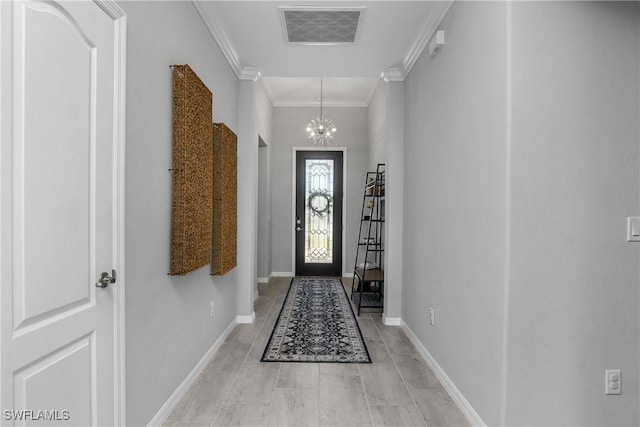 17326 Ashcomb Way, Estero, FL 33928 - foyer entrance featuring ornamental molding, baseboards, and a chandelier