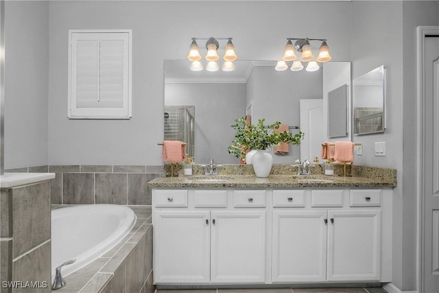 17326 Ashcomb Way, Estero, FL 33928 - bathroom with a bath, double vanity, a shower stall, crown molding, and a chandelier