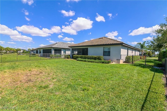 17326 Ashcomb Way, Estero, FL 33928 - rear view of property featuring stucco siding and a tiled roof