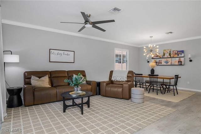 17326 Ashcomb Way, Estero, FL 33928 - living room featuring crown molding, a chandelier, a ceiling fan, baseboards, and light wood-style floors