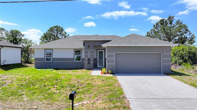 3711 6th St W, Lehigh Acres, FL 33971 - view of front of house featuring stucco siding, a garage, a front lawn, driveway, and a shingled roof