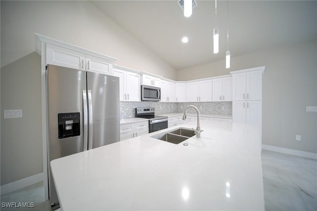 3711 6th St W, Lehigh Acres, FL 33971 - kitchen featuring appliances with stainless steel finishes, a sink, tasteful backsplash, white cabinets, and high vaulted ceiling