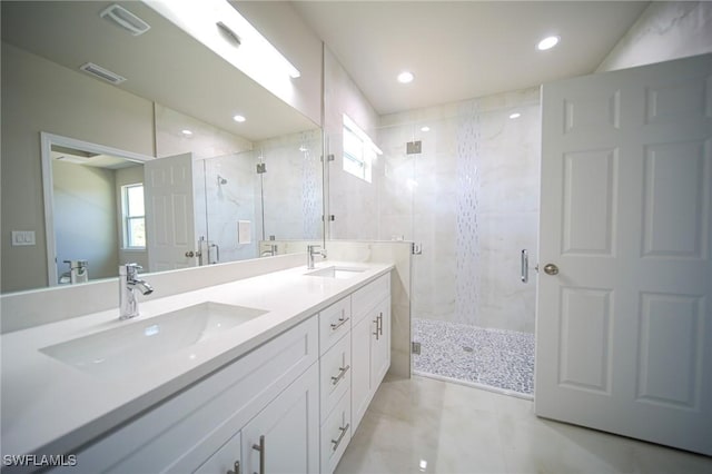 3711 6th St W, Lehigh Acres, FL 33971 - full bathroom with healthy amount of natural light, a shower stall, double vanity, and recessed lighting