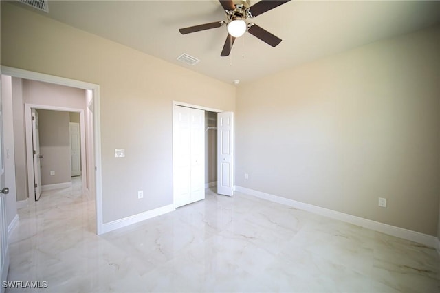 3711 6th St W, Lehigh Acres, FL 33971 - unfurnished bedroom with light marble finish flooring, a closet, baseboards, and ceiling fan