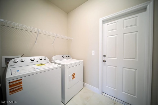 3711 6th St W, Lehigh Acres, FL 33971 - washroom with washer and clothes dryer and baseboards