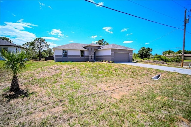 3711 6th St W, Lehigh Acres, FL 33971 - view of front of home with driveway, a garage, stucco siding, and a front yard